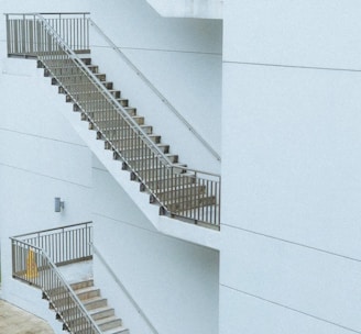 white concrete building with white staircase