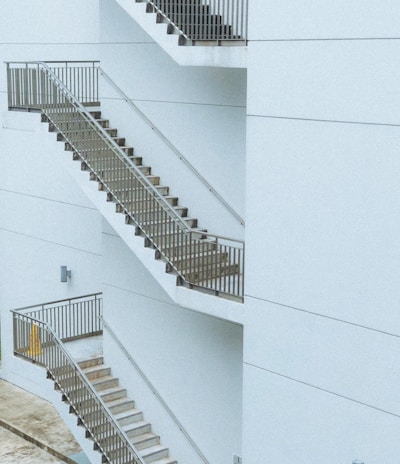 white concrete building with white staircase
